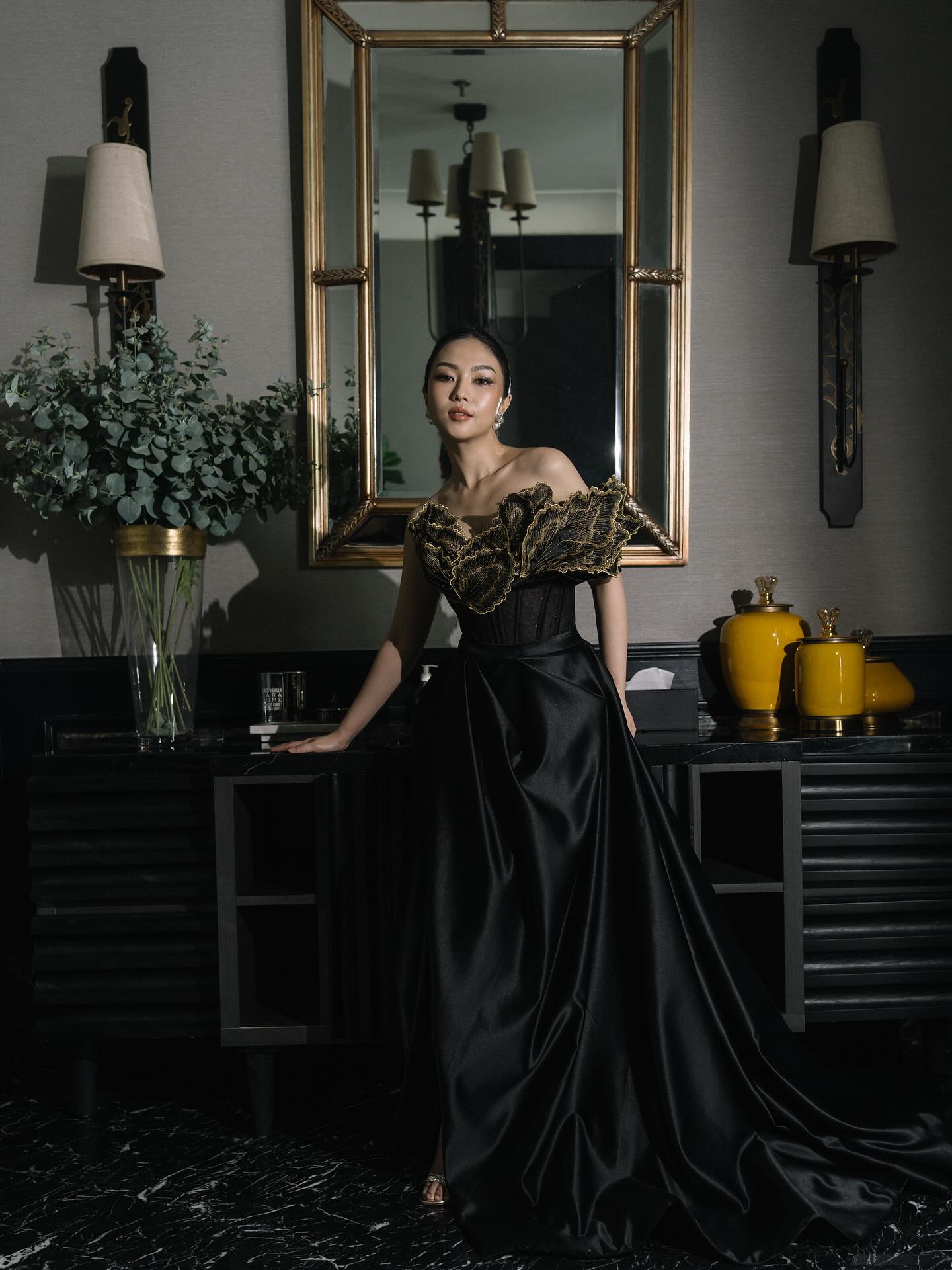 Black satin evening gown with sculptural gold bodice by CELRA