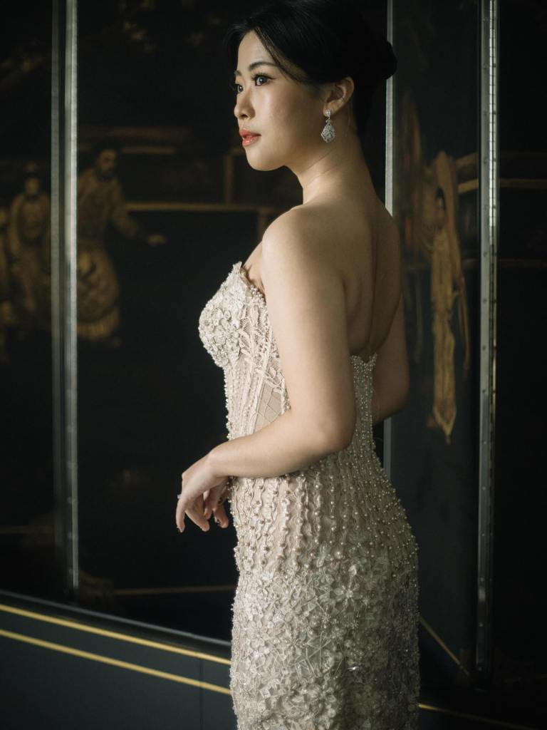 Champagne beaded lace gown in side profile by CELRA