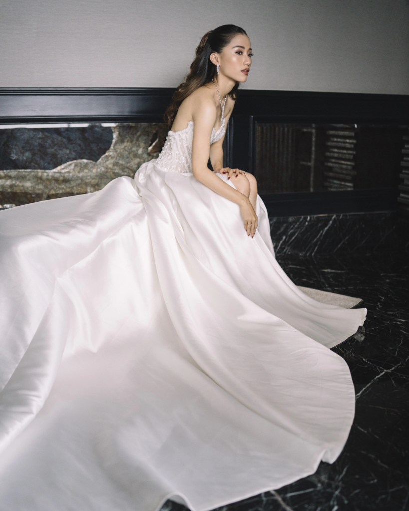 Bride twirling in a flowing white gown by CELRA